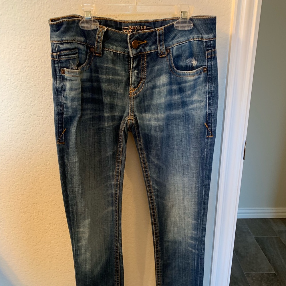 Buckle skinny jeans